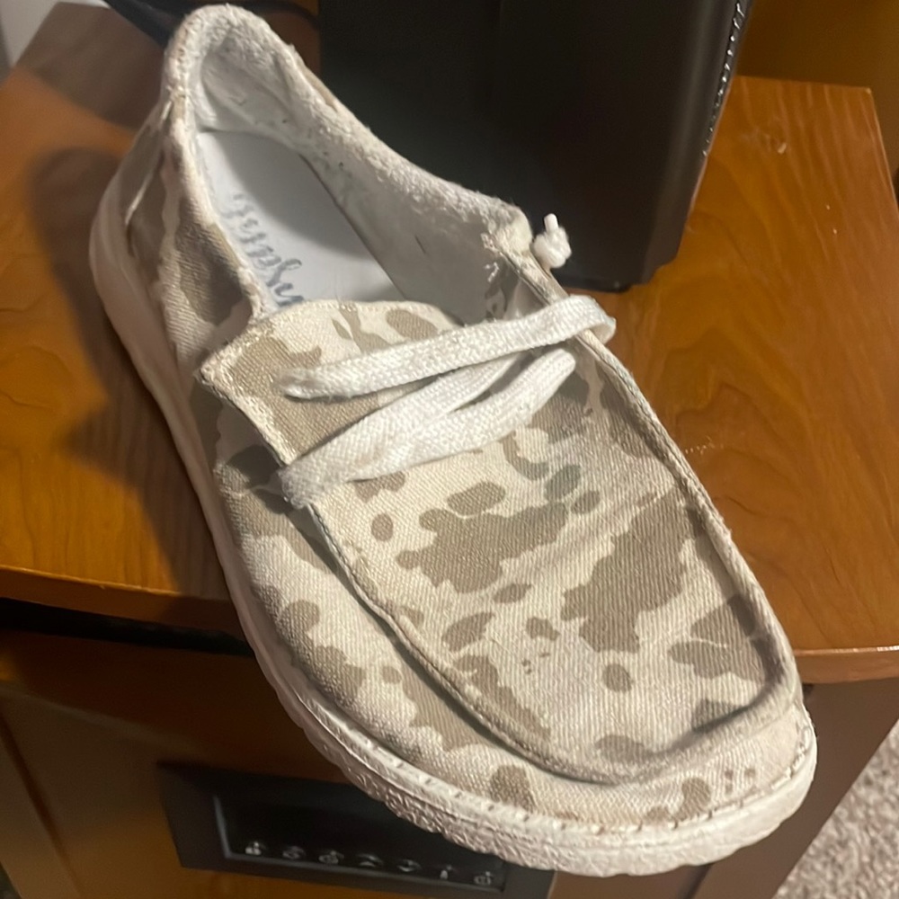 Cow print slip on shoes